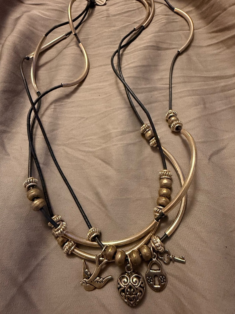 Layered Bronze Charm Necklace with Heart & Bird Pendants by lizzy james design